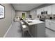 Open concept kitchen with a large island, stainless steel appliances, and ample cabinet space at 907 Donahue Pass, Lake Hamilton, FL 33851