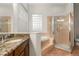 Bathroom featuring a tiled shower, soaking tub, and granite vanity at 926 Ridgeland Ct, Apopka, FL 32712