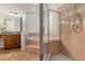 Bright bathroom featuring a walk-in shower with glass block window and a large soaking tub at 926 Ridgeland Ct, Apopka, FL 32712
