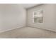 Neutral bedroom with neutral carpet and a window with view of the front yard at 926 Ridgeland Ct, Apopka, FL 32712