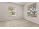 Bright bedroom with neutral carpet, two windows with views of the landscaped yard at 926 Ridgeland Ct, Apopka, FL 32712