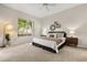 Bright bedroom with a large window, neutral decor, and comfortable furnishings at 926 Ridgeland Ct, Apopka, FL 32712