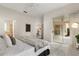 Serene bedroom with a ceiling fan, neutral color palette, and access to a private outdoor patio at 926 Ridgeland Ct, Apopka, FL 32712