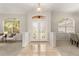 Elegant foyer featuring tile flooring, decorative glass double doors, and arched windows at 926 Ridgeland Ct, Apopka, FL 32712