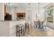 Charming kitchen featuring a breakfast bar, warm wood cabinets, and a cozy dining nook with a view at 926 Ridgeland Ct, Apopka, FL 32712