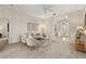 Spacious living room with neutral walls, plush seating, and an entryway featuring decorative glass doors at 926 Ridgeland Ct, Apopka, FL 32712
