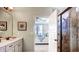 Bathroom featuring a glass-enclosed shower and a view into the bedroom, creating a luxurious and connected space at 11003 Hollow Bay Dr, Winter Garden, FL 34787