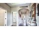 Bright hallway with recessed lighting, arched doorways, and hardwood floors leading to other rooms in the home at 11003 Hollow Bay Dr, Winter Garden, FL 34787