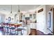 Modern kitchen featuring an island with bar seating, stainless steel appliances, and custom cabinetry for ample storage at 11003 Hollow Bay Dr, Winter Garden, FL 34787