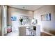 Bright studio space featuring a table, artwork, shelving, and natural light, perfect for art and crafts at 11003 Hollow Bay Dr, Winter Garden, FL 34787