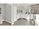 Bright bathroom with a double sink vanity, walk-in shower, and grey tiled flooring at 11057 Hollow Bay Dr, Winter Garden, FL 34787