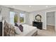 Bright bedroom featuring natural light, neutral walls, modern furniture, and a spacious walk-in closet at 11057 Hollow Bay Dr, Winter Garden, FL 34787