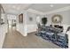 Dining room featuring wood floors, decorative mirror, and elegant wainscoting throughout at 11057 Hollow Bay Dr, Winter Garden, FL 34787