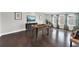 Spacious game room with dark wood flooring, plenty of light, and foosball table at 11057 Hollow Bay Dr, Winter Garden, FL 34787