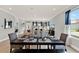 Open-concept living and dining area featuring wood floors and lots of natural light at 11057 Hollow Bay Dr, Winter Garden, FL 34787