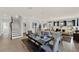 Open-concept living area with dining area, staircase, and wood floors at 11057 Hollow Bay Dr, Winter Garden, FL 34787