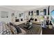 Bright living room with neutral paint, wood floors, and modern furnishings at 11057 Hollow Bay Dr, Winter Garden, FL 34787
