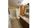 Bathroom with a shower/tub combo, granite countertop, and tiled floor at 12527 Floridays Resort Dr # 506-E, Orlando, FL 32821