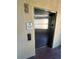 View of a building elevator with instructions posted on the wall at 12527 Floridays Resort Dr # 506-E, Orlando, FL 32821