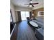 Comfortable living room with balcony access offers ample seating and natural light at 12527 Floridays Resort Dr # 506-E, Orlando, FL 32821