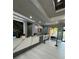 View of lobby reception desk with marble accents, modern lighting and a wall-mounted tv at 12527 Floridays Resort Dr # 506-E, Orlando, FL 32821
