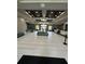 Bright lobby features tiled flooring, comfortable seating and a decorative light fixture at 12527 Floridays Resort Dr # 506-E, Orlando, FL 32821