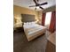 Inviting bedroom with cozy bedding, bedside tables, and warm accents at 12527 Floridays Resort Dr # 506-E, Orlando, FL 32821