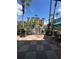 Gated pool area features lush landscaping, chairs, and several vacation rental buildings at 12527 Floridays Resort Dr # 506-E, Orlando, FL 32821