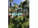 Beautiful pool area with palm trees and lounge chairs for relaxing in the sun at 12527 Floridays Resort Dr # 506-E, Orlando, FL 32821