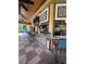A beautiful open poolside bar offers a tiled counter, flatscreen TVs, and ceiling fans at 12527 Floridays Resort Dr # 506-E, Orlando, FL 32821