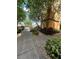 Scenic walkway with benches and verdant landscaping along the building exterior at 12527 Floridays Resort Dr # 506-E, Orlando, FL 32821