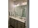 Modern bathroom with double sinks, stylish fixtures, and a glass-enclosed shower at 1266 Spotted Sandpiper Loop, Winter Springs, FL 32708