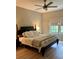 Serene bedroom with a comfortable bed, soft lighting, and a view of the outdoors at 1266 Spotted Sandpiper Loop, Winter Springs, FL 32708