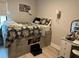 Cozy bedroom featuring a bed with storage drawers and a charming vanity area, perfect for relaxation at 1266 Spotted Sandpiper Loop, Winter Springs, FL 32708