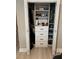Well-organized closet with custom shelving and built-in drawers for optimal storage at 1266 Spotted Sandpiper Loop, Winter Springs, FL 32708