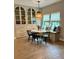 Bright dining area featuring a built-in banquette, modern table, and elegant decor at 1266 Spotted Sandpiper Loop, Winter Springs, FL 32708