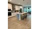 Spacious kitchen with a large island, white cabinets, and stainless steel appliances at 1266 Spotted Sandpiper Loop, Winter Springs, FL 32708
