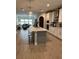 Open kitchen with a large island, modern appliances, and seamless flow to the living area at 1266 Spotted Sandpiper Loop, Winter Springs, FL 32708