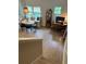 Open-concept living space with dining area, built-in bench and a convenient home office setup at 1266 Spotted Sandpiper Loop, Winter Springs, FL 32708