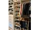 Extensive walk-in closet with ample shelving, hanging rods, and drawers for storage at 1266 Spotted Sandpiper Loop, Winter Springs, FL 32708