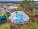 Aerial view of community pool, playground, and amenities in a Gathering-friendly neighborhood at 1323 Berry Ln, Davenport, FL 33837