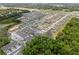An aerial view of a Primary-planned community with modern homes and lush landscaping at 1323 Berry Ln, Davenport, FL 33837