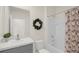 Cozy bathroom with tub shower combination and decorative wreath at 1323 Berry Ln, Davenport, FL 33837