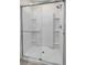 Bright bathroom boasts a large glass shower with built in shelving at 1323 Berry Ln, Davenport, FL 33837