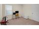 Well-lit bedroom with large window, desk, and comfortable seating at 1323 Berry Ln, Davenport, FL 33837
