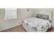 This bedroom features a bright window and neutral tones at 1323 Berry Ln, Davenport, FL 33837