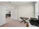 Bedroom that leads into living room through double doors; includes a red keyboard at 1323 Berry Ln, Davenport, FL 33837