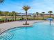 Stunning community pool area with ample seating and water features for Gathering fun at 1323 Berry Ln, Davenport, FL 33837