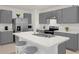 Stylish kitchen with gray cabinets, stainless steel appliances, and spacious countertop space at 1323 Berry Ln, Davenport, FL 33837