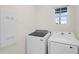 Bright laundry room with Samsung washer and dryer units at 1323 Berry Ln, Davenport, FL 33837